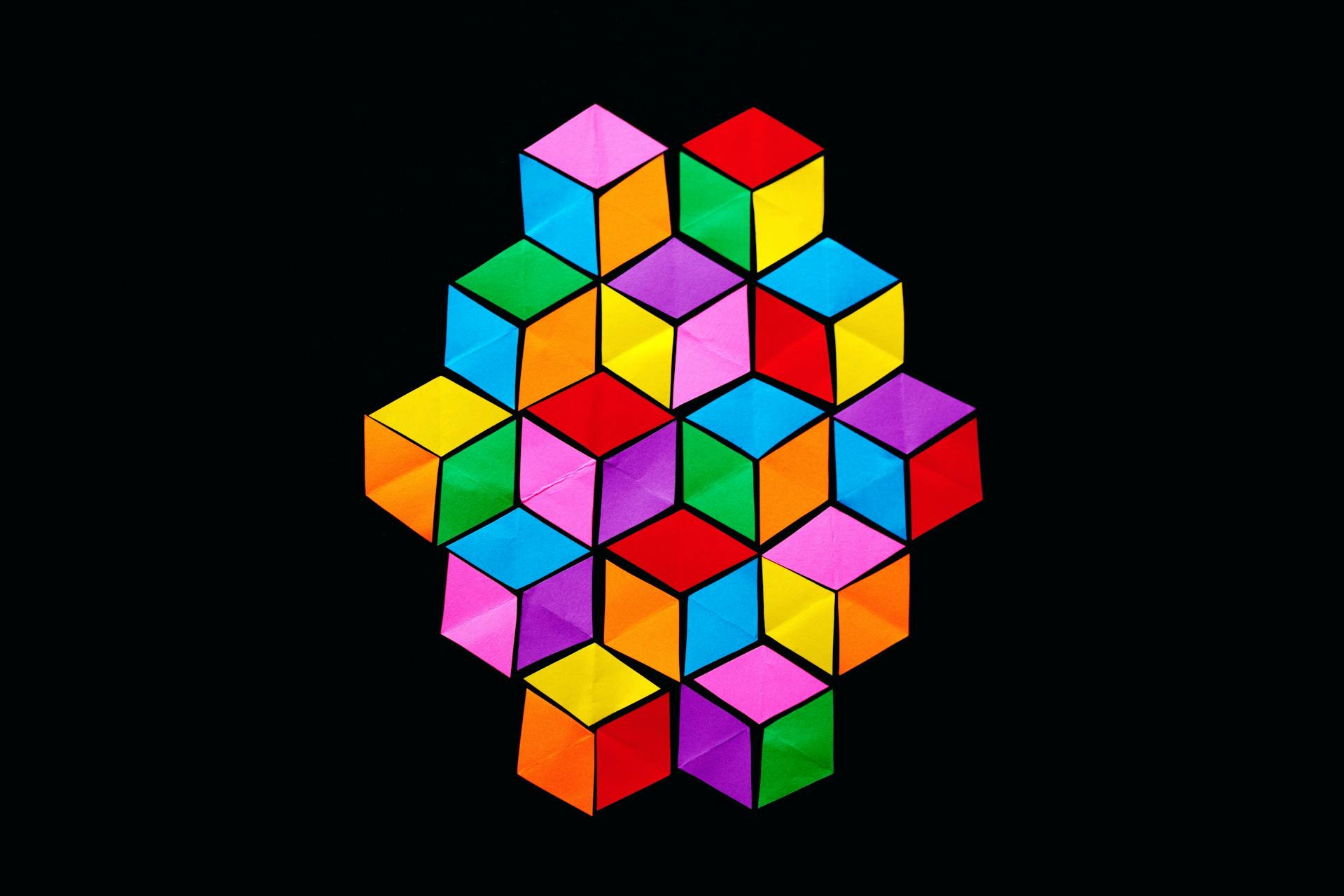 Multiple multi-coloured cubes arranged in a pattern.